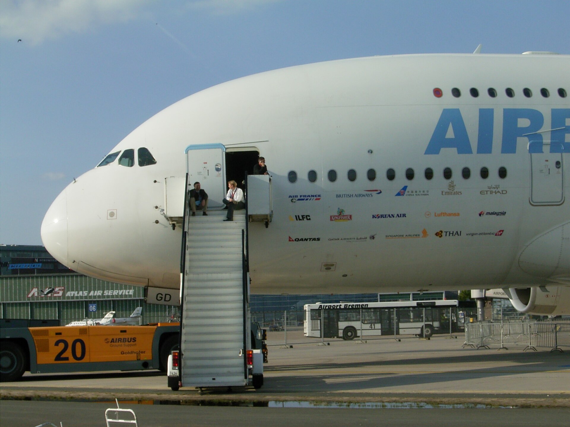 An Airbus A380 viewed from the front at an airport